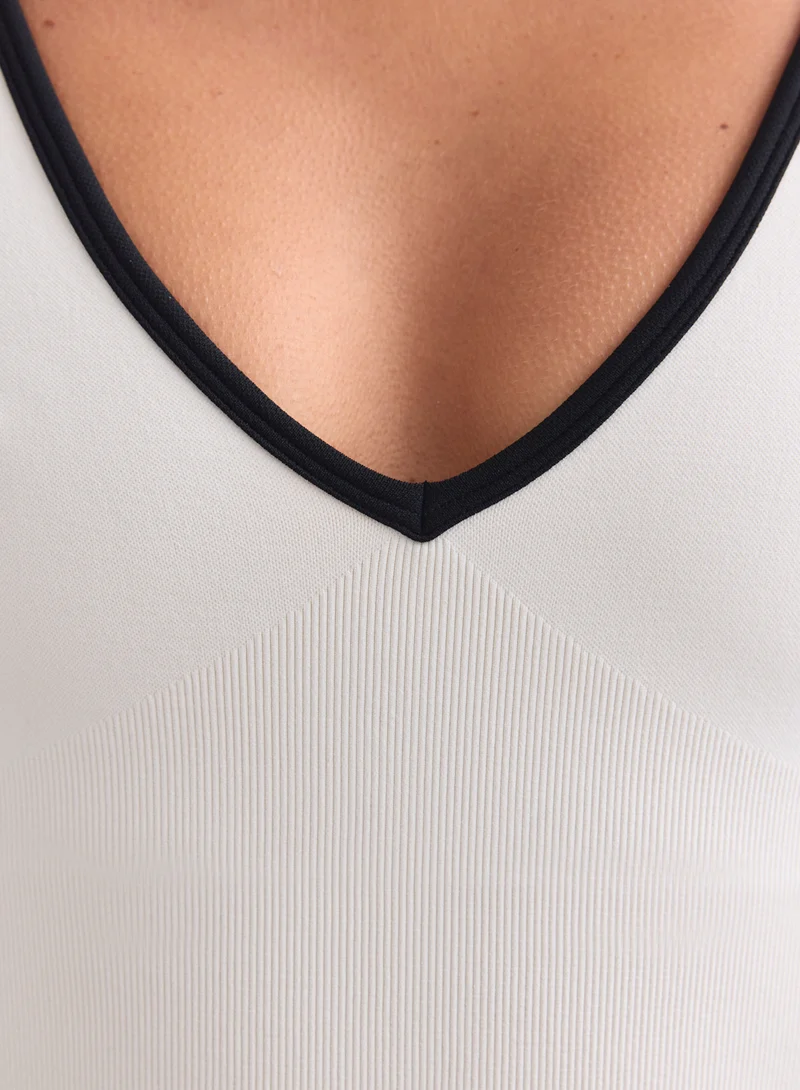 Cream Black Shape Seamless Deep Cut Singlet